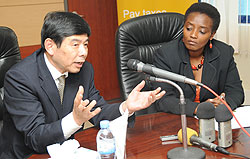 The Secretary General of the World Customs Organization Kunio Mikuriya (L) addresses the press as RRAu2019s Mary Baine looks on (Photo; J. Mbanda)