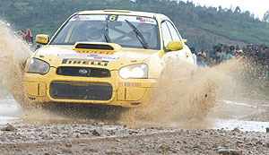 Natioanal champion Giancarlo cruises his Subaru on a flooded road during a past event. He is one of nine local drivers who entered this weekendu2019s race in Huye. (File photo)
