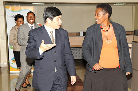 The Secretary General of the World Customs Organization Kunio Mikuriya (L) with RRAu2019s Mary Baine.(Photo J Mbanda)