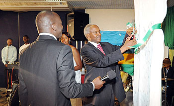 Dr. Charles Muligande cutting the ribbon to launch the campaign (Photo;J. Mbanda)