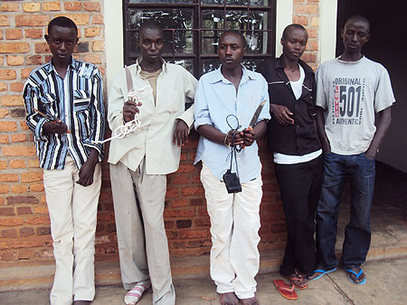 The suspects being paraded at Rwamagana Police Station with some of their weapons (Photo; S. Rwembeho)