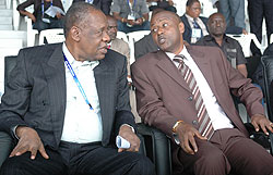 Kazura (R) shares a light moment with CAF president Issa Hayatou during the U20 CAN. (File Photo)