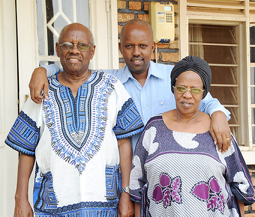 Mzee zirimwabagabo (L) with their last born Nils (C) and Mukaferesi at their home in Kabeza. (Photo by Timothy .K.)