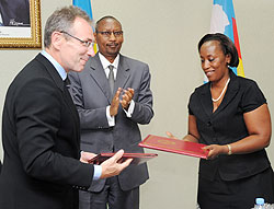 Andris Pierbalgs, John Rwangombwa (center) and Lillian Gashumba after signing the grant agreement yesterday (Photo; T. Kisambira)