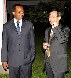 Vincent Karega and Amb. Sun Shuzhong during the celebrations yesterday (Photo; T. Kisambira)