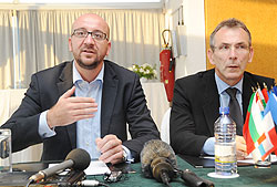 Charles Michel and Andris Piebalgs, the EU commissioner of Development at a press conference (Photo; T. Kisambira)