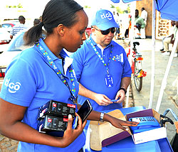 Tigou2019s Marketing Manager Ndabaneze and CEO Marcelo Aleman selling products to revellers recently (File Photo)