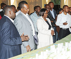 The Minister of Infrastructure, Vincent Karega (2nd left) and other officials being briefed on the Kigali City Master plan yesterday (Photo; J. Mbanda)