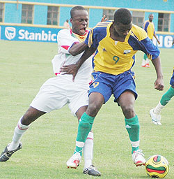 Elias Uzamukunda a.k.a Baby tries to shield off a Mali player during last yearu2019s U-20 Caf African Championship. (File photo)