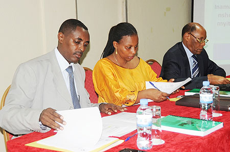 The Executive Secretary of CNLG, Jean de Dieu Mucyo (L) and other officials during the meeting (Photo; T. Kisambira)