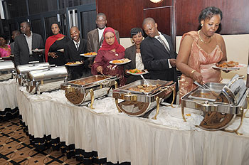 Dinner time. Guests service themselves at the celebrations.Ugandau2019s Isaiah