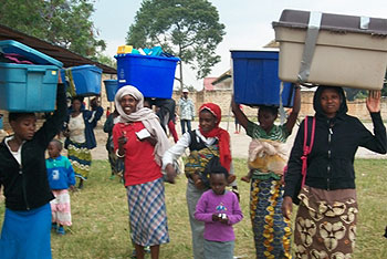 GO Rwanda beneficiaries walk away with the donated items (Courtesy photo)