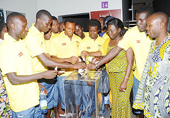 Benin players make donations to the Kigali Genocide Memorial Centre. (Photo J Mbanda)
