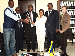 KIST rector and the staff posing for a photo with the prize (Photo F Ndoli)
