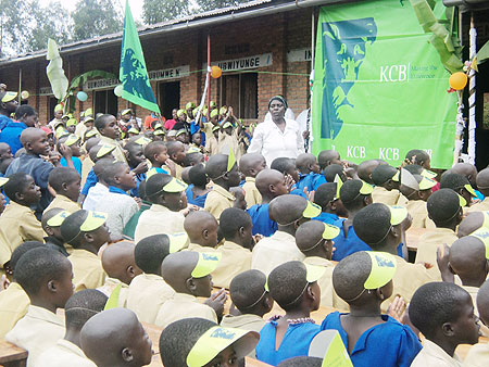 KCB lent support to  over 700 pupils of Mubona Primary School as part of its social responsibility programmes. (Photo: B. Mukombozi)