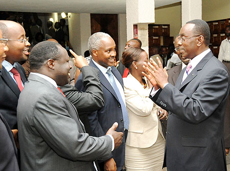 Prime Minister Bernard Makuza (R) sharing a light moment with Ministers of the Cabinet after presenting the governmentu2019s 7-year programme to both chambers of Parliament yesterday. (Photo T.Kisambira)