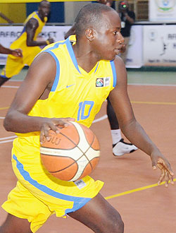 Rwandau2019s Igor Mugisha drives in for a lay-up during the Congo-Brazzaville game. Rwanda face Tunisia in one of four quarter-final matches this afternoon. (Photo: T. Kisambira)