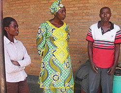 Gakeri with his wife (centre) and their employee at Remera police station yesterday. (Photo. B. Asiimwe)