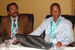 Prof. Jose Mathai (L) flanked by Pierre Clever Rutayisire of NUR during the conference in Kampala last week (Photo; E. Kabeera)