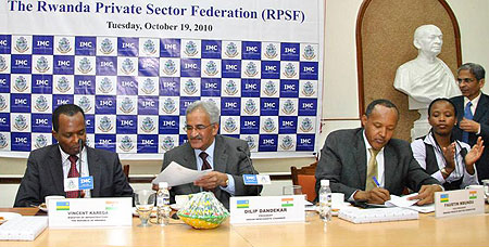 (L-R)Minister Karega, Dandekar of the Indian Merchants Chamber of Commerce, Faustin Mbundu of PSF and Claire Akamanyi of RDB at the MOU signing ceremony (courtesy photo)