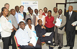 Some of the civil servants who participated in the English training with their certificates (Photo; T. Kisambira)