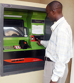 A customer using an ATM, Central Bank needs increased ATM transaction to keep liquidity in the banking system and cut banking costs (File photo)