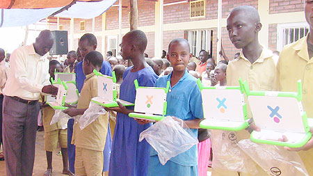 Mayange Primary School pupils receiving the laptops. (Photo: S. Rwembeho)
