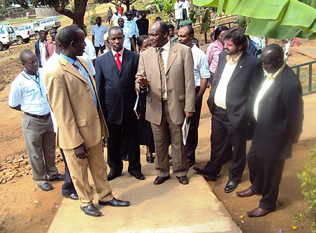 Dr. Charles Nkuranga (C), local leaders and ADRA officials touring the project (Photo; S. Rwembeho)
