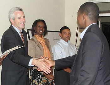 Michael Brennan, OTF Group Rwanda Project Director congratulates one of the graduands (courtesy photo)