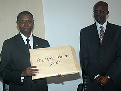 The State Minister for Primary and Secondary Education,Dr. Mathias Harebamungu (L) displays 2009 Ou2019Level results as RNECu2019s John Rutayisire looks on (File photo)