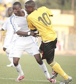Rwandau2019s Michel Rusheshangoga (left) wrestles for the ball with a Ugandan defender during this yearu2019s U-20 Cecafa tournament in Eritrea (Photo Cecafa)