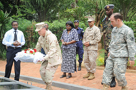 Rear Admiral Brian L. Losey paying tribute to genocide victims at Kigali Genocide Memorial centre yesterday (Photo; J. Mbanda)