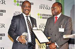 Joel Kibaso presenting the award for Socially Responsible Bank of the Year to Tek Koroye, Executive Director, Operations, Access Bank Plc