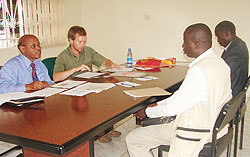 Dr James Vuningoma (L)  with Hunter Paris from USA Peace Corps interviewing some of the Teachers at the High Commision in Kampala yesterday (Photo E.Kabeera)