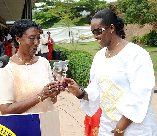 The founding Principal of La Colombiere, Franu00e7oise Nyirantagorama awards the First Lady, Jeannette Kagame, yesterday (Photo; T. Kisambira)
