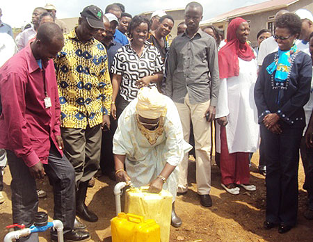 Dr. Mujawamariya commissioning a water stand for ex- combatants in Rutaraka (Photo; D. Ngabonziza)