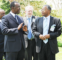 Prime Minister Bernard Makuza (L) chats with Kenyan Trade Minister Chirau Ali Mwakwere yesterday (Photo; J. Mbanda)
