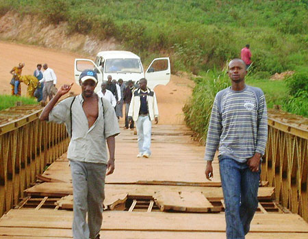 Vehicles cannot cross the bridge and people have to walk across the bridge (Photo; S. Rwembeho)