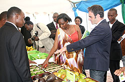 Official inspecting some of Rwandau2019s agricultural products, yesterday, during the agribusiness investment forum (photo / T. Kisambira)