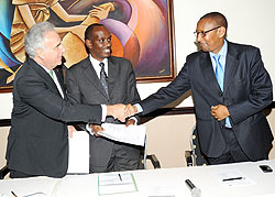 L- R; Michel Kazatchkine, Richard Sezibera and John Rwangombwa after signing. (Photo J Mbanda)