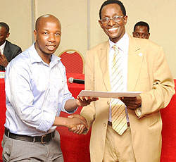 Prof. Geoffrey Rugege awarding a certificate to one of the students yesterday (photo T.Kisambira)