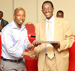 Prof. Geoffrey Rugege awarding a certificate to one of the students yesterday (photo T.Kisambira)