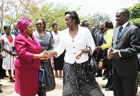 First Lady Jeannette Kagame greets Dr.Sheila Tlou (L), the Regional Director for UNAIDS-Eastern and Southern Africa as Health Minister Dr. Richard Sezibera looks on.(Photo J Mbanda)