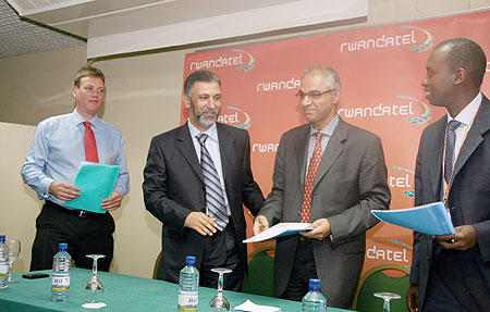 Rwandatel officials deliberating on the company products recently. (File photo)