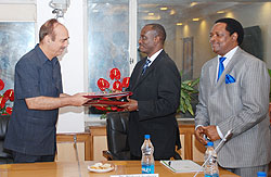 Health Minister Dr. Richard Sezibera and his Indian couter part Ghulam Nabi Azada after signing. Rwandau2019s envoy to India Williams Nkurunziza looks on. Courtesy photo