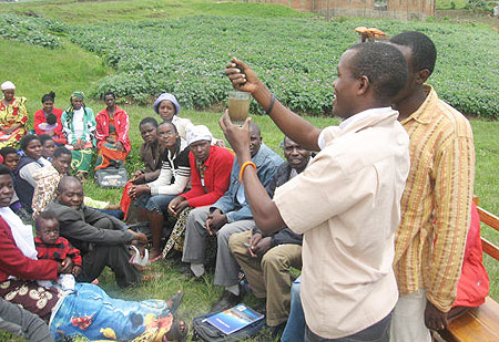 Hyppolite Ntigurirwa demonstrating to farmers during the theater training. 