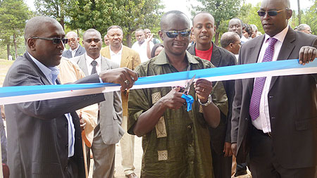 Sports Minister Joseph Habineza cuts the tape, on the right is Diack Thierno, Olympafrica official and Rwanda NOC boss Dr. Charles Rudakubana.  Photo B Mugabe