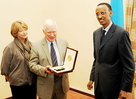 Amb Colin Keating with his wife after receiving the decoration from President Paul Kagame yesterday (Photo T.Kisambira)