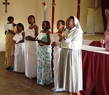 Sister Epiphanie Mukabaranga (R) awarding certificates of merit to students (Photo; S. Rwembeho)