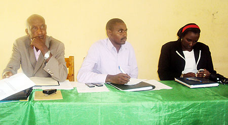 NECu2019s Frank Kayiranga (C) and local leaders during the meeting with the residents (Photo; S. Rwembeho)